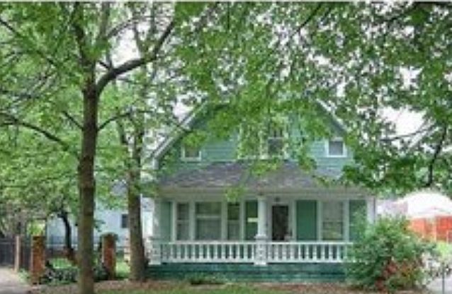 Great front porch on a wooded lot