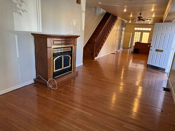 Living Room w/Fireplace, hardwood floors, and Cable ready!