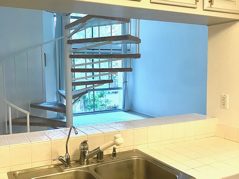 New kitchen faucet being installed.