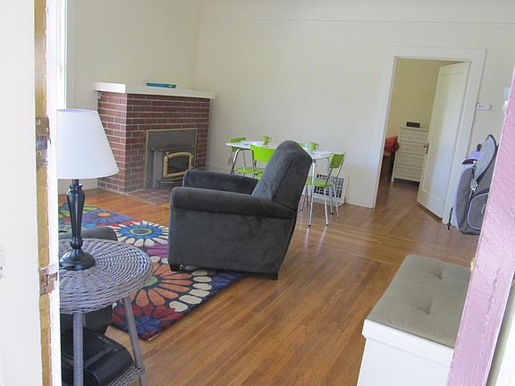 The other side of the living room with the entry to the bedroom.
Sorry but fireplace is not in use ~ decorative only.