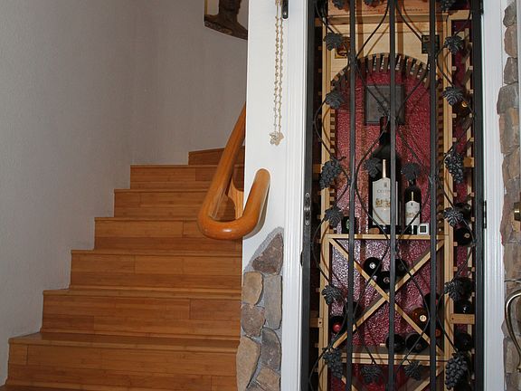 Foyer to upstairs, wine room
