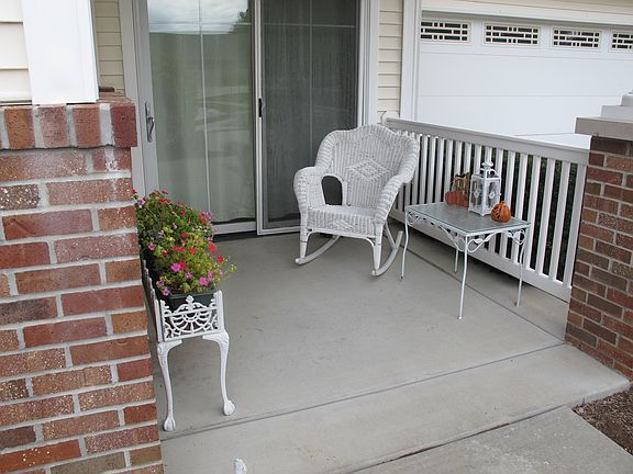 covered porch by pond