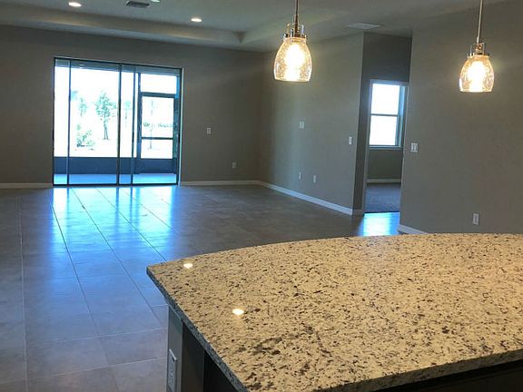 Open Flow Gathering Room Adjacent to Kitchen