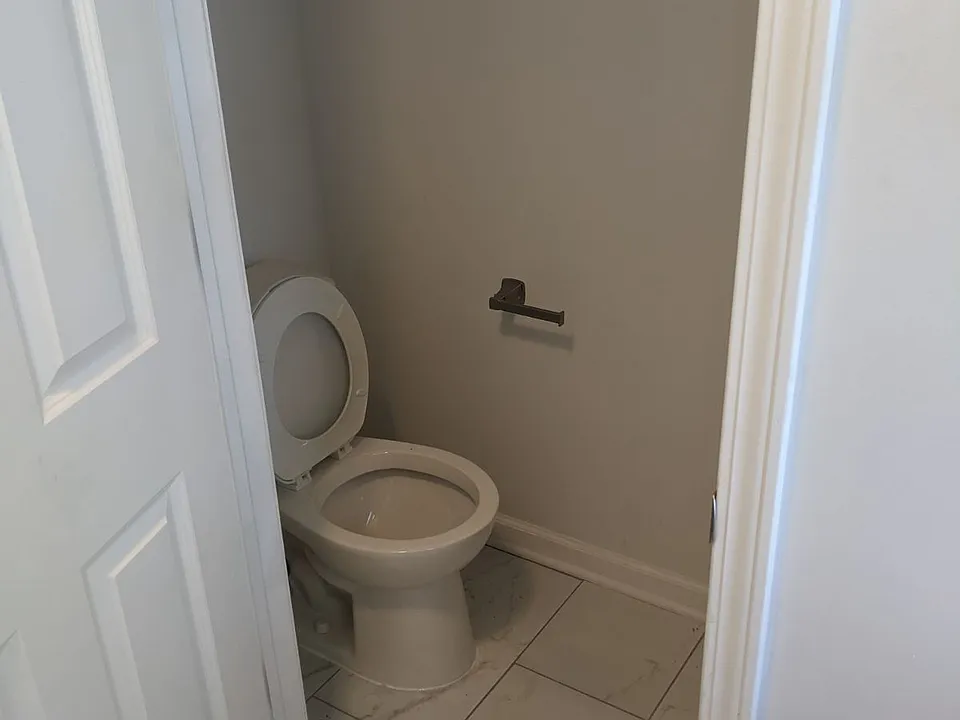 1/2 Bathroom off the back entrance