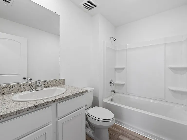 Second bathroom also includes granite countertops.