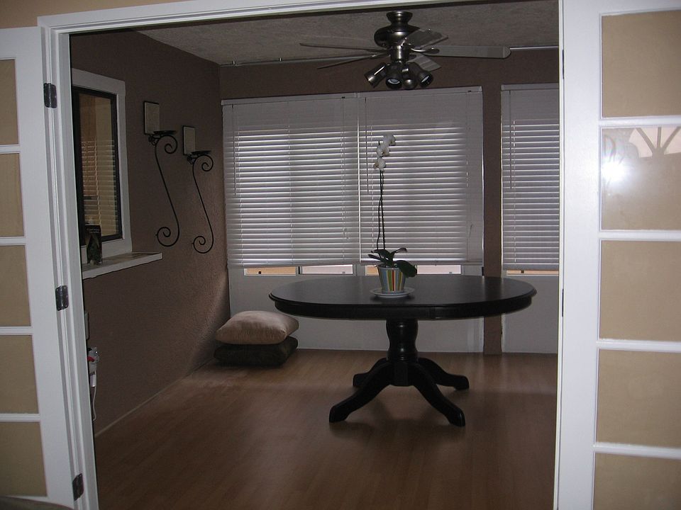 Patio converted to Dining Space w/ double french doors from the living room.