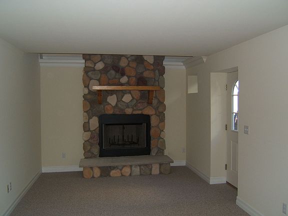 Family Rm w/stone wood-burning fireplace