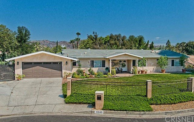Front View with beautiful landscaping.
