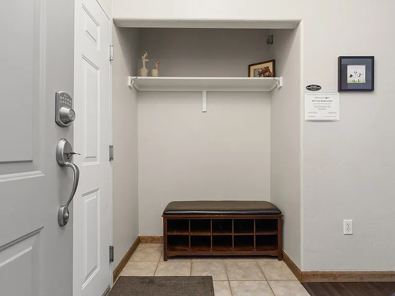 Entryway with Door to Garage on Left
