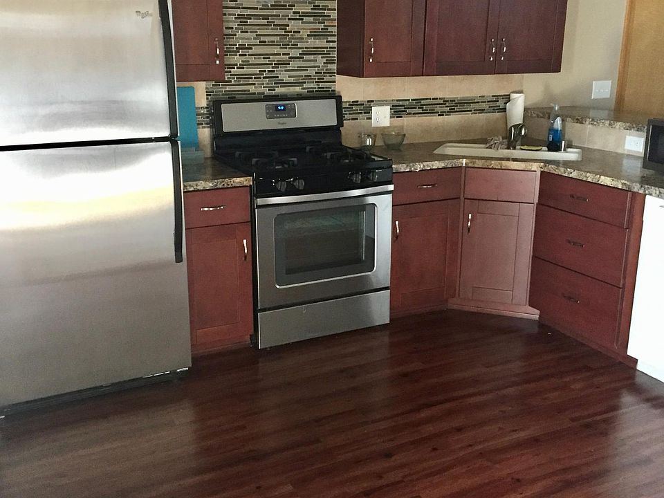 Kitchen, which also features raised countertop for barstool seating