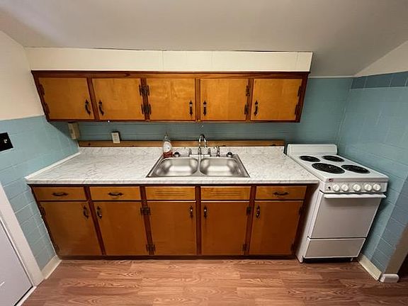 Kitchen cabinets, sink, oven