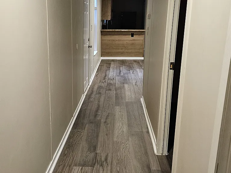 Hallway leading to living room area from Bedroom#1 and #2