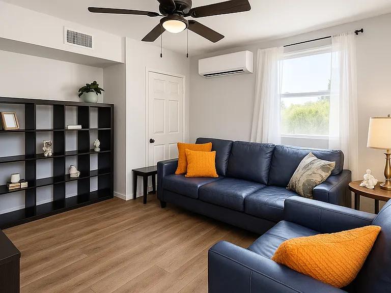 Spacious living room with smart TV, cozy seating, natural light, ceiling fan, and fast Wi-Fi_perfect for relaxing, remote work, or a night in. A bright and comfortable space to unwind after exploring Globe.