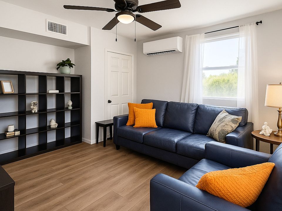 Spacious living room with smart TV, cozy seating, natural light, ceiling fan, and fast Wi-Fi_perfect for relaxing, remote work, or a night in. A bright and comfortable space to unwind after exploring Globe.