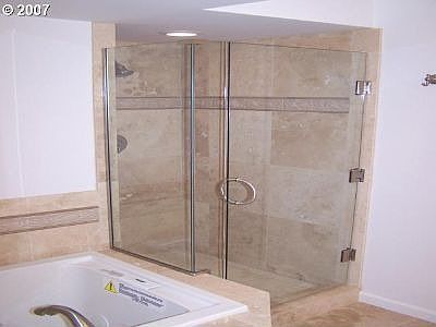 jetted tub with Glass shower