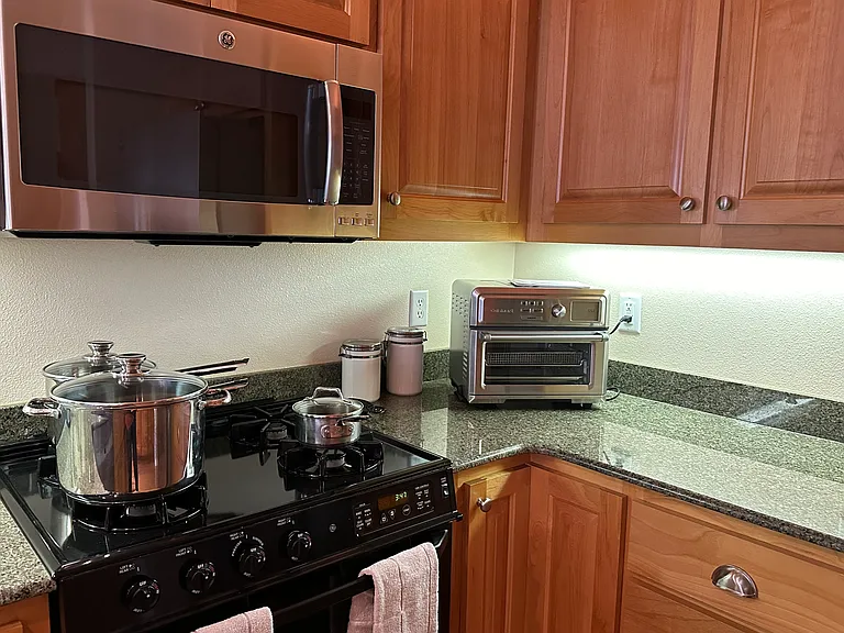Cuisinart set up with cooking utentils and gas stove