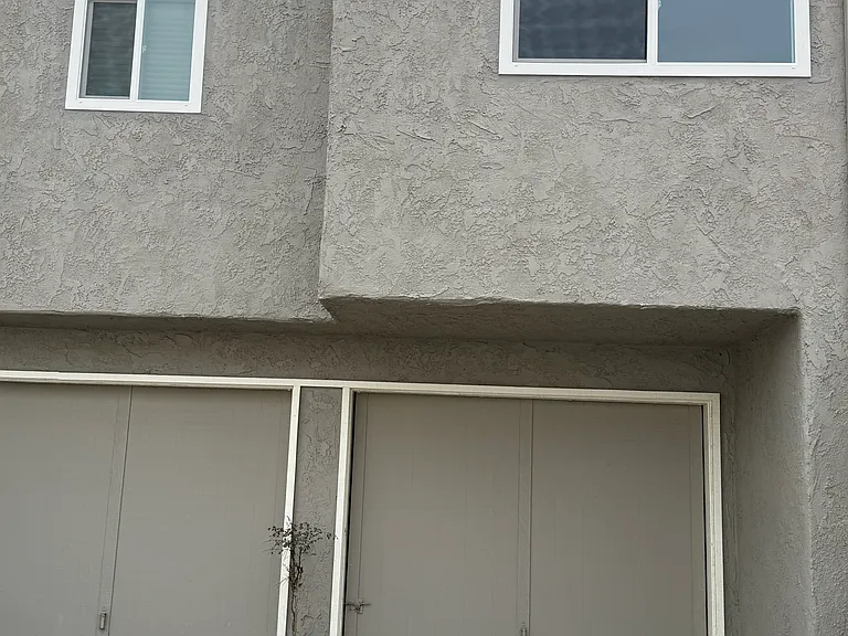 One car garage with access to house. 
A separte paring space is also included.