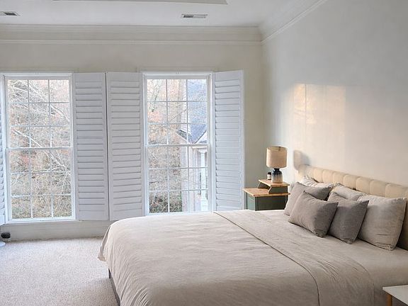 Master bedroom with plenty of natural light and high ceiling