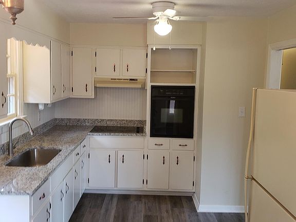 Eat in kitchen with new granite countertops and LVP flooring.