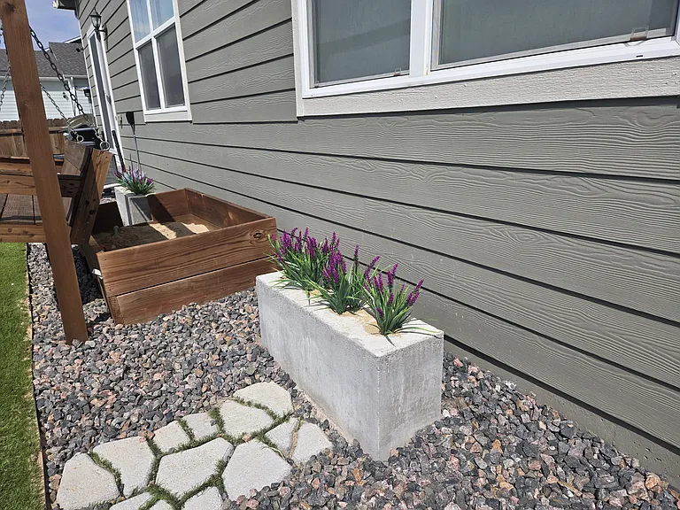 Swing, Cement planters and sandbox