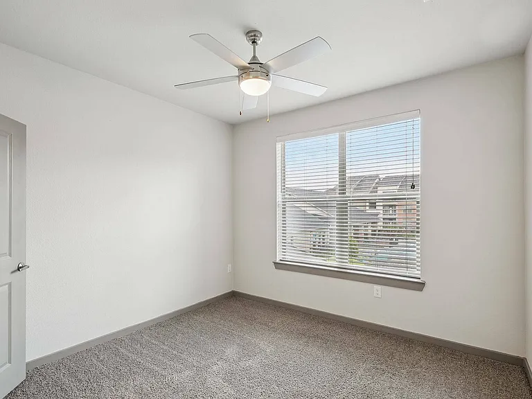 Enjoy a bright and comfortable bedroom designed for relaxation at Cityscape Apartments in Houston.