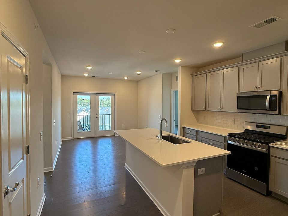 Kitchen and great room looking from entrance hallway area