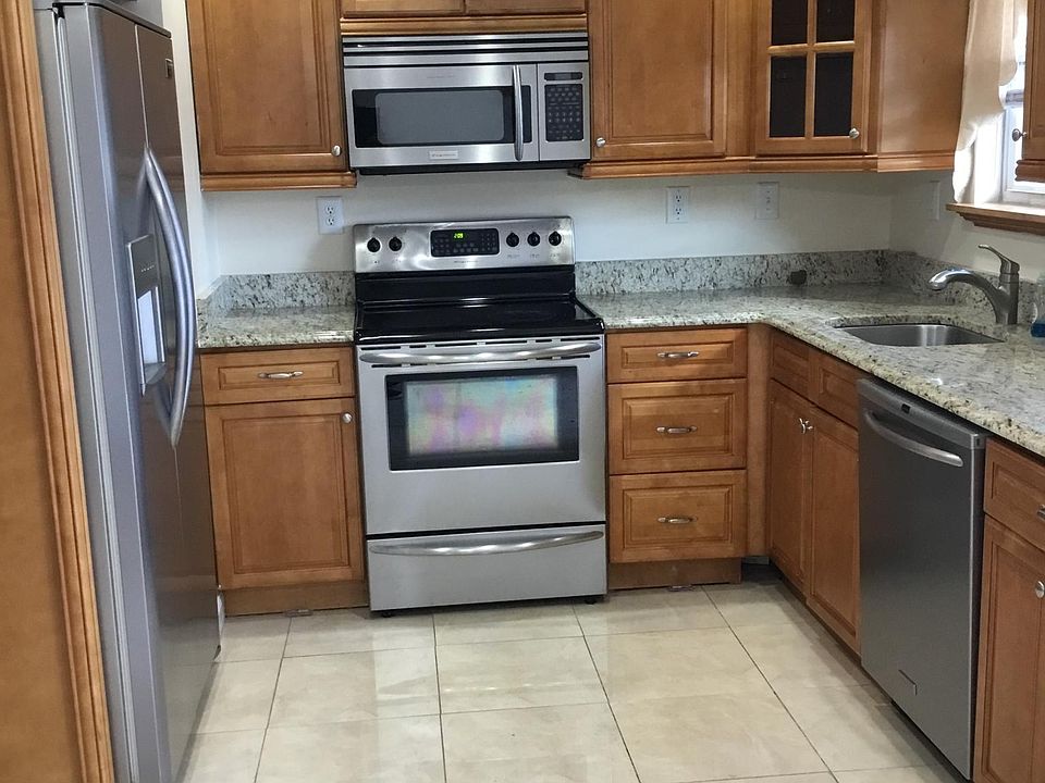 Kitchen with Stainless Steel Appliances and Granite Countertops