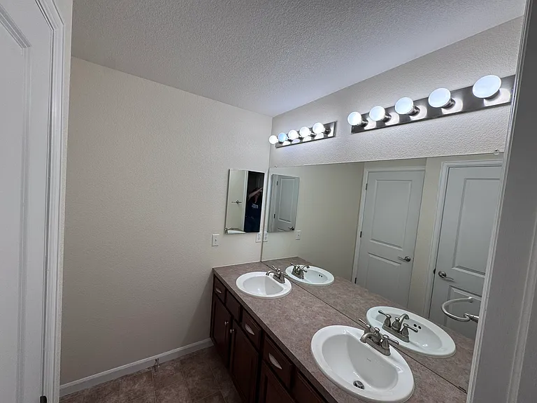 Upstairs full bathroom, includes two sinks and a bathtub/shower