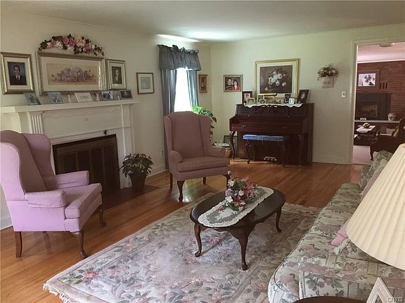 Living room has a wood-burning fireplace.