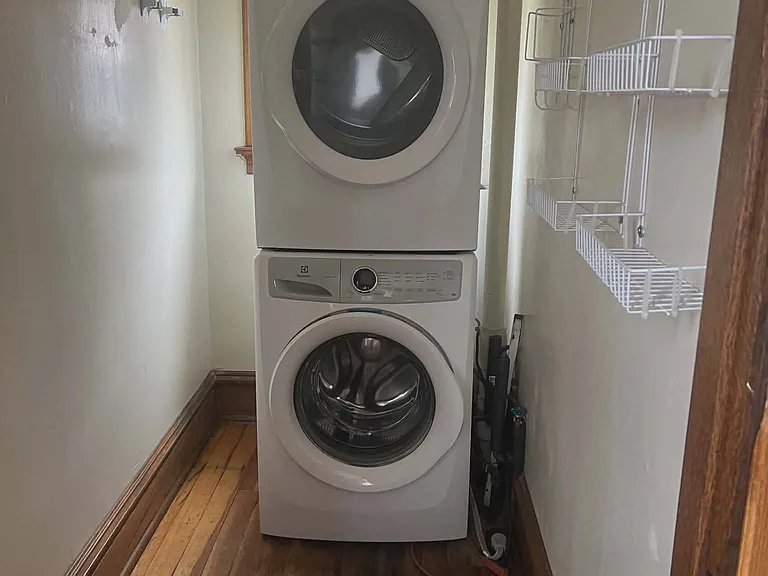 Butler pantry with stackable washer/dryer.