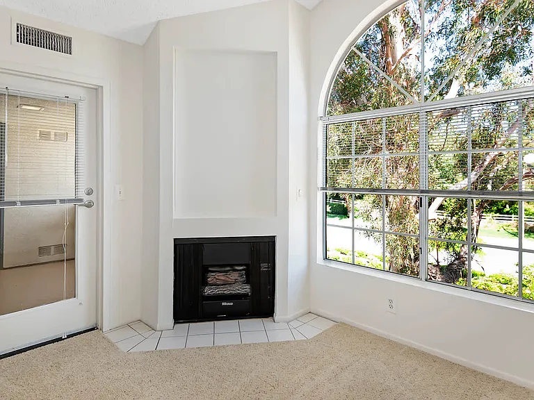 Carpeted Living Room with Fireplace