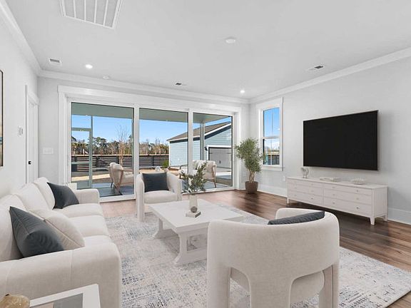 Bright Living Room. Model Home Representation.