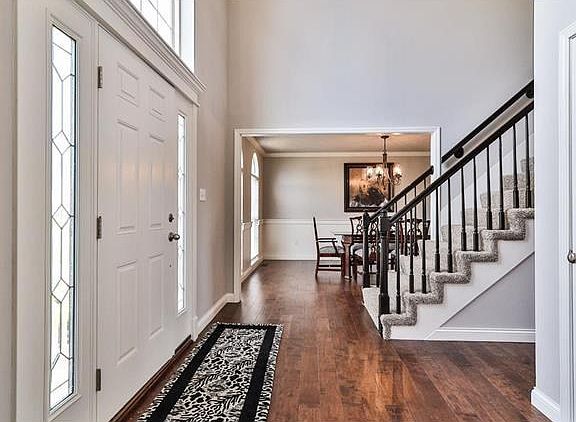 A view from the Side Entry toward the Dining Room beyond.  Notice that the entry to the Dining Room has been cased in a classic trim.
