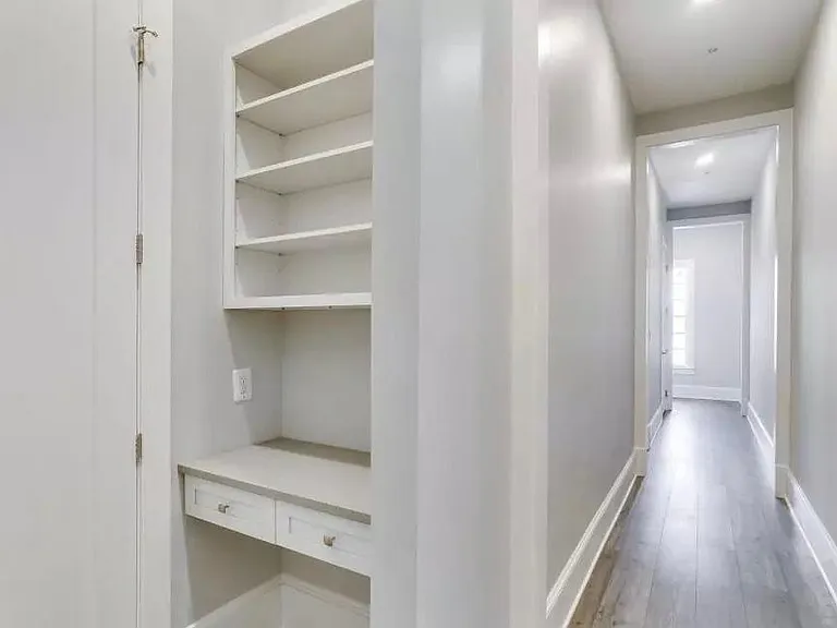 desk area and powder room off of hallway to master bedroom and elevator