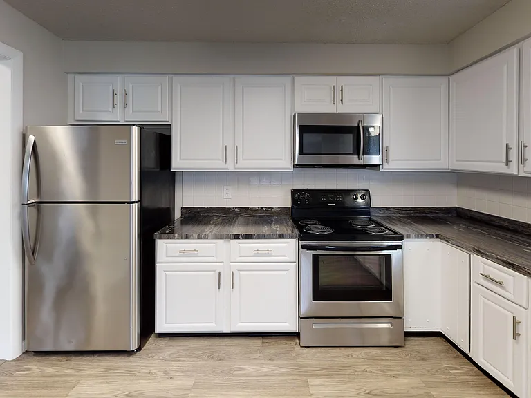 The Pioneer's kitchen is designed for both function and style, offering a modern cooking space with stainless-steel appliances, abundant cabinets, and updated finishes.