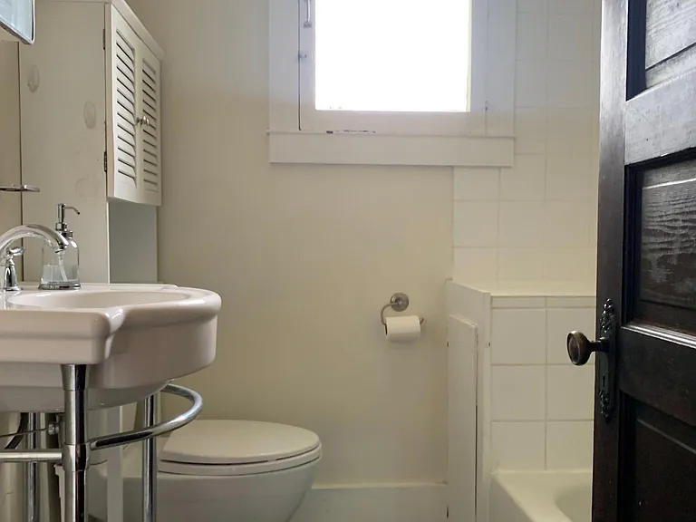 Bathroom includes a soaking tub with shower