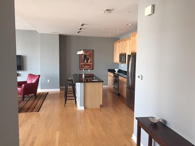 Entry to large, loft like space with open concept and hardwo
