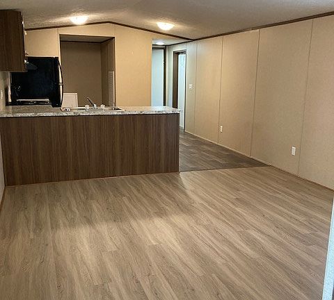 Den and kitchen. New flooring and LED lights.