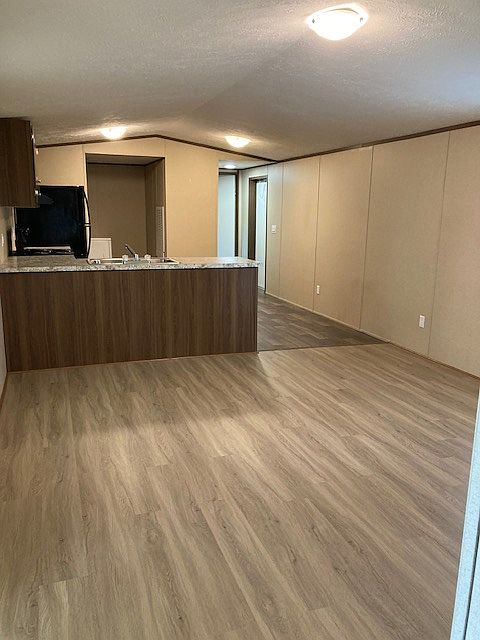 Den and kitchen. New flooring and LED lights.