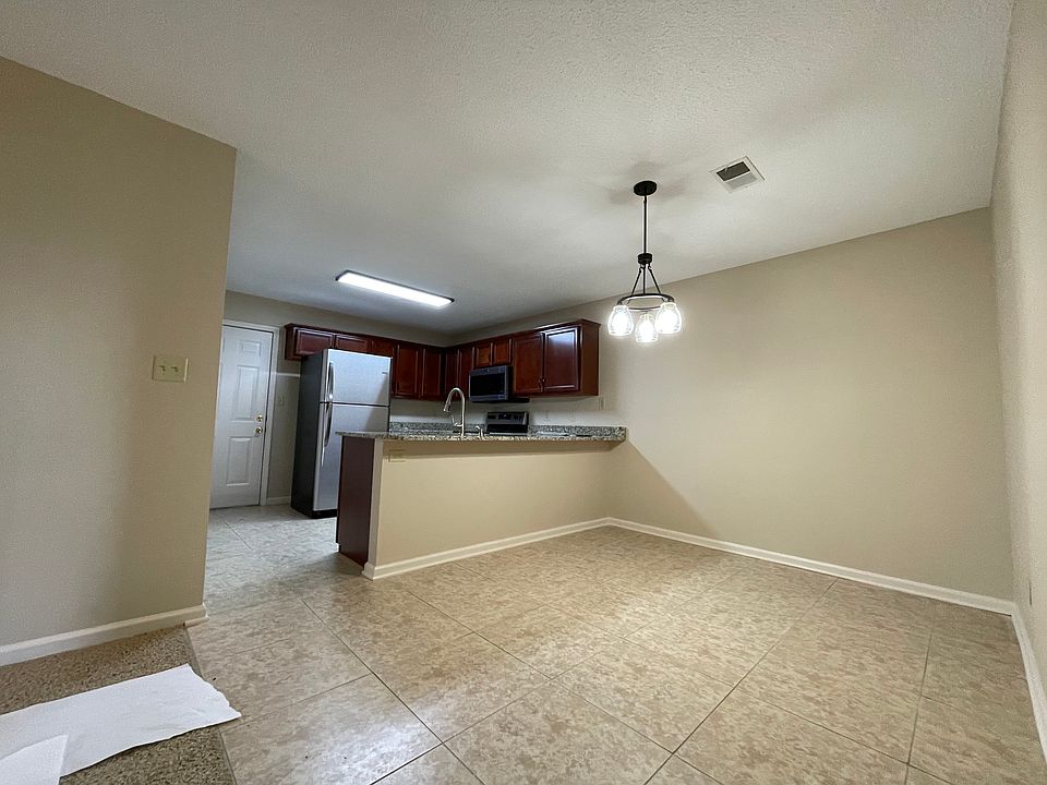 Spacious kitchen with dining room area porcelain tile