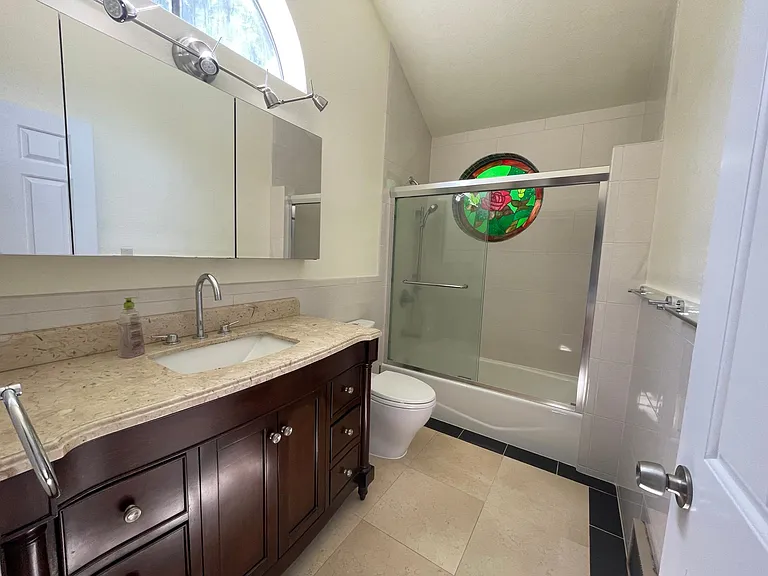 bathroom #1 with medicine cabinet and high ceiling