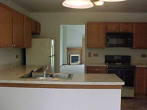 Galley style kitchen with breakfast nook