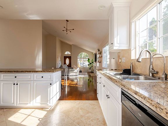 View of dining area and living room from kitchen