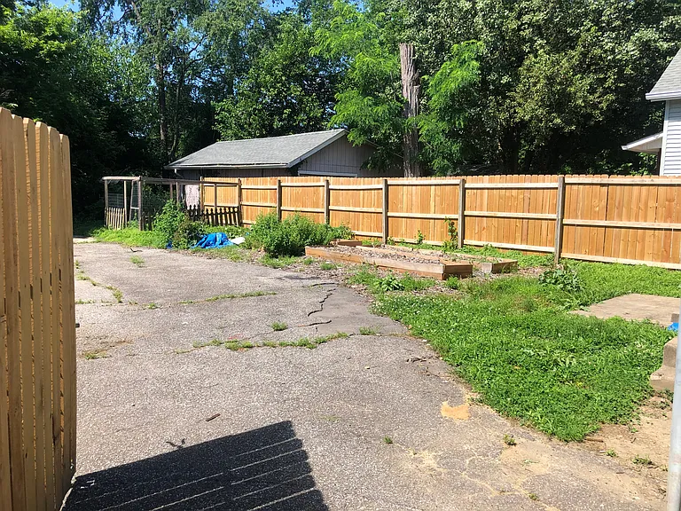 Backyard with raised beds. Previous owners even had a chicken coop!