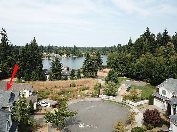 Great cul-de-sac with lake views from the park & upstairs bonus & bedroom. 