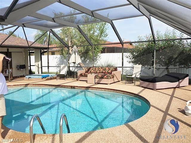 Relax on your private screened patio with plenty of space for everyone