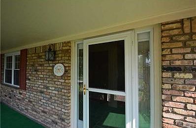 Porch. Long, enclosed front porch ideal space for morning coffee and spectacular views