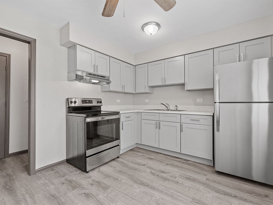 KITCHEN 1 - Completely remodeled. Everything is new: Cabinets, Floors, Stove, Fridge, Range hood, Lights, Ceiling fan, Sink & Faucet.