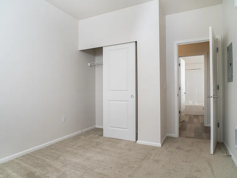 Bedroom with closet and bathroom access Bedroom with closet and bathroom access
