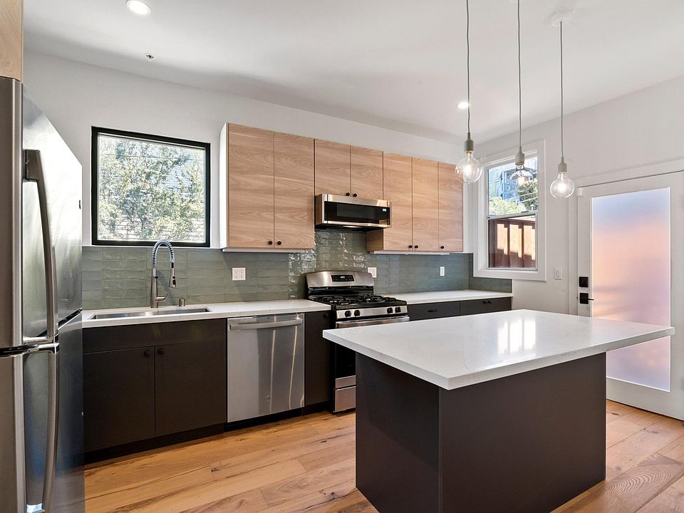 Custom Cabinetry, Quartz Countertops, New Stainless Steel kitchen appliances